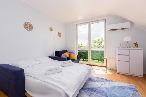 Llit o llits en una habitació de Puck Marine Apartment by BookingHost