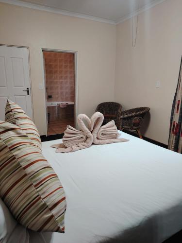 Postel nebo postele na pokoji v ubytování Gooderson Leisure Natal Spa Self Catering and Timeshare Resort