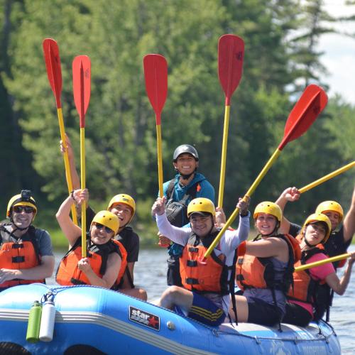 a group of people in a raft on a river at L'Appartement du Pavillon - Rafting Momentum in Bryson