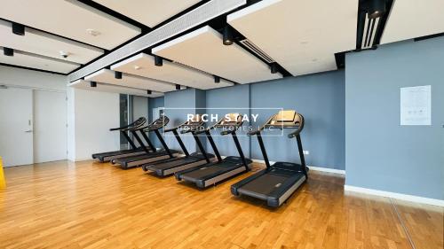 a row of treadmills in a fitness room at Crystal Clear 1BR in Blue Waters with Ain View in Dubai