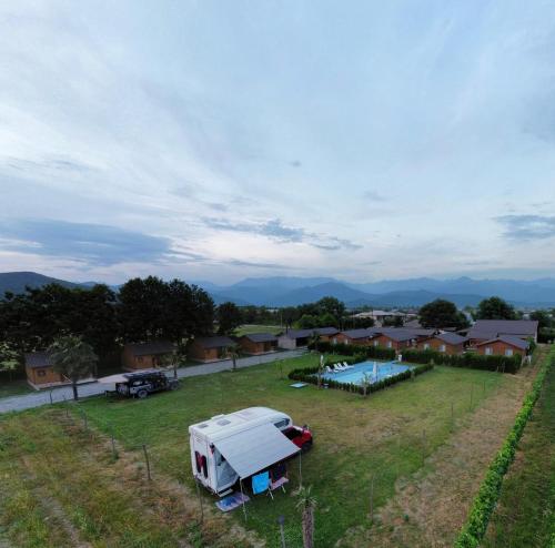 an aerial view of a farm with a trailer and a pool at Finca Idoize Camping Hotel in Akhmety