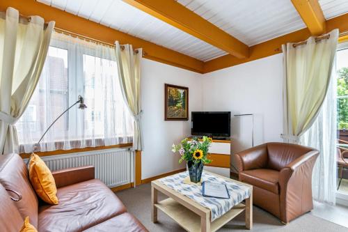 a living room with a couch and a table at Atlanta Pur in Pellworm