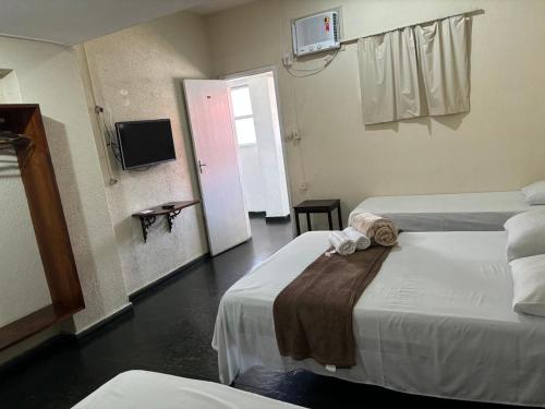 Postel nebo postele na pokoji v ubytování HOTEL DOCE LAR