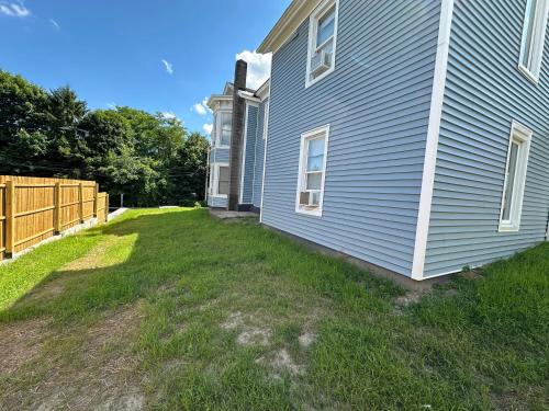 a side view of a house with a yard at 3rd Base Apt 1 All Star Baseball Rentals in Oneonta