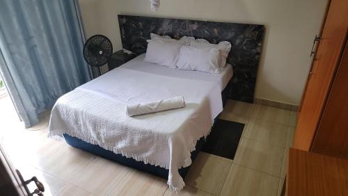 Ένα ή περισσότερα κρεβάτια σε δωμάτιο στο HARRIET APARTHOTEL Kigali-NYARUTARAMA