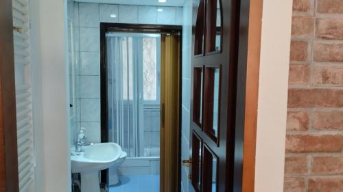 a bathroom with a sink and a mirror at La Vecchia Posta in Anzano del Parco