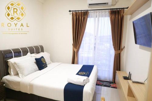 Ένα ή περισσότερα κρεβάτια σε δωμάτιο στο Royal Suites Studio 10RS - Citra Plaza Nagoya