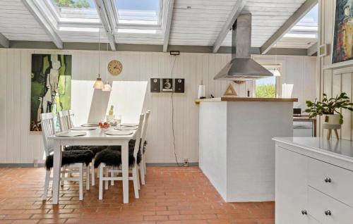 a kitchen with a table and chairs in a room at 3 Bedroom Beautiful Home In Vinderup in Vinderup