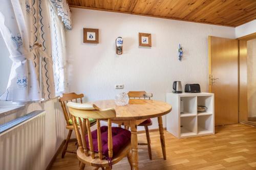 a dining room with a table and chairs at Bergmannsruh in Clausthal-Zellerfeld