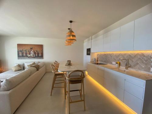 a living room with a couch and a table at Miraflores Beach & Country Club in Mijas Costa