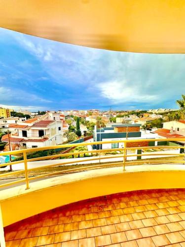 a view of a city from a balcony at Casa do Mar Faro in Faro