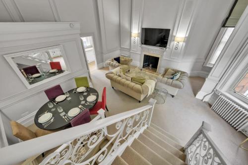 an overhead view of a living room with a table and chairs at Knightsbridge - Hans Place Apartments in London