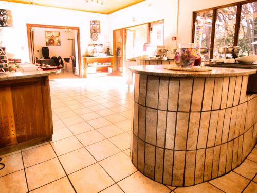 a kitchen with a large island in the middle of a room at Hotel 247 @ White River in White River