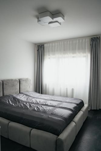 Ένα ή περισσότερα κρεβάτια σε δωμάτιο στο E&S Apartments 1