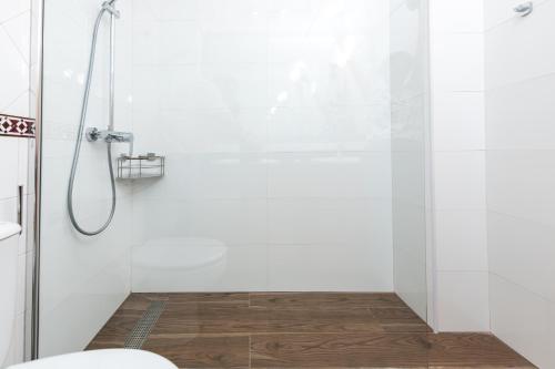 a bathroom with a shower and a toilet at Calas Beach Corralejo in Corralejo
