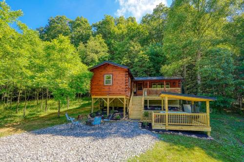 a log cabin in the middle of a forest at Moonlight Waters by Pond in South Bloomingville
