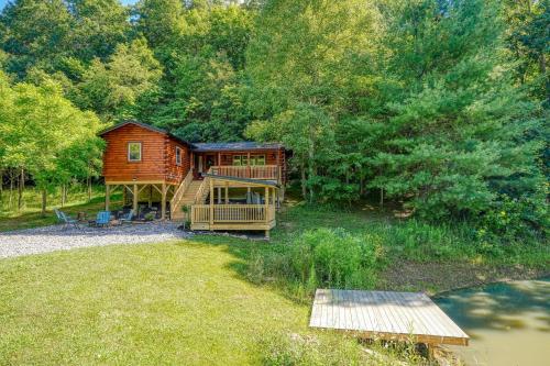 a cabin in the middle of a field with trees at Moonlight Waters by Pond in South Bloomingville