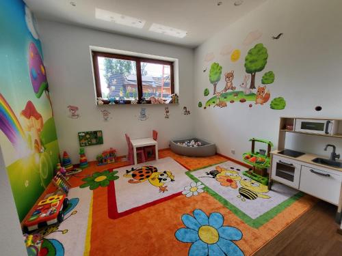 a childs room with aesame street mural on the wall at Chałpa u Zbójnika in Zakopane
