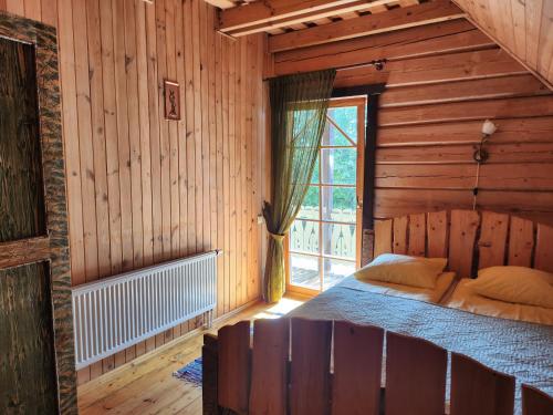 Postel nebo postele na pokoji v ubytování Sodyba "Gervinė"