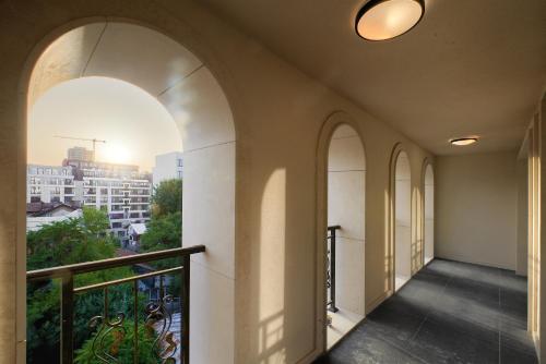 a balcony with arches and a view of a city at Aurora Sofia in Sofia