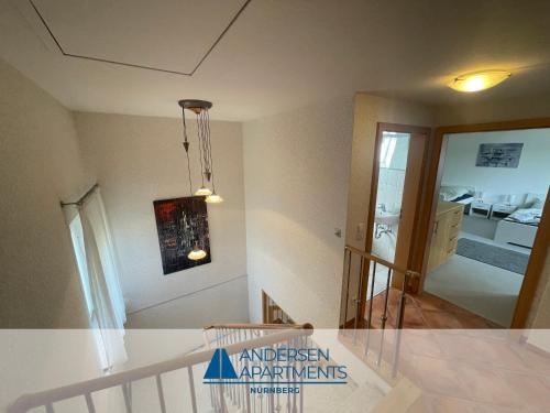 a kitchen with a counter top and a dining room at Toplage für Beruf & Freizeit in Nürnberg - Andersen Apartments in Nürnberg