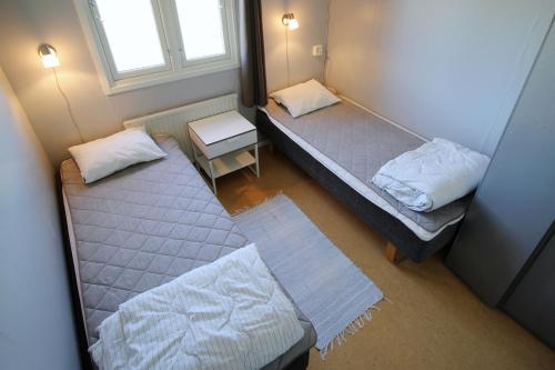 an overhead view of two beds in a room at STF Bunge Hostel in Fårösund