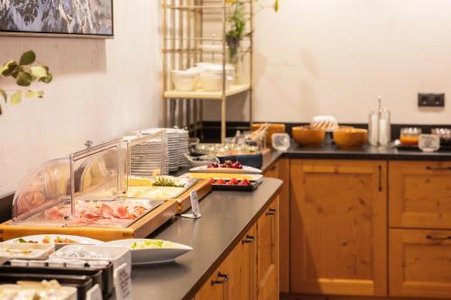 a kitchen with a buffet of food on a counter at Bruggerhof in Fulpmes