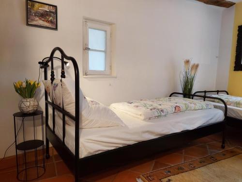 a bedroom with two beds and a window at Ferienhaus Old Winery in Briedel