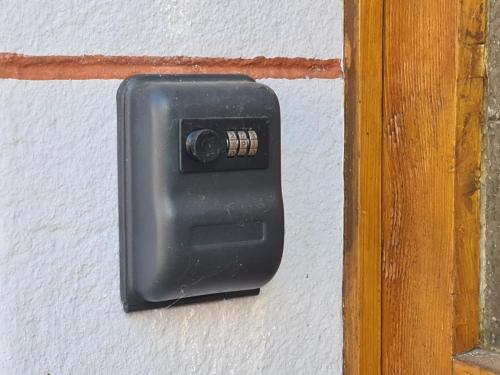 a light switch on a white wall at Haus Kurtrier in Merl