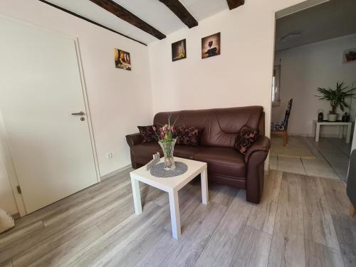 a living room with a couch and a table at Haus Kurtrier in Merl