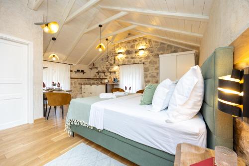 a bedroom with a large bed in a room at Kruna apartments est 2024 in Split
