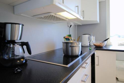 a kitchen with a coffee maker on a counter at STF Bunge Hostel in Fårösund
