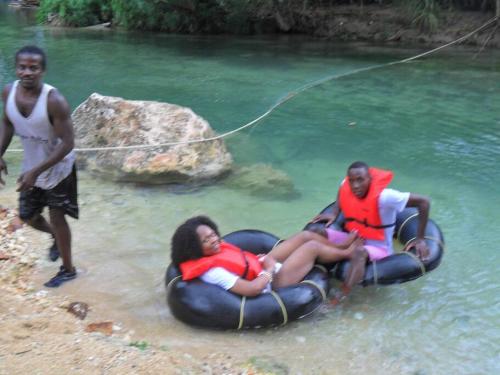 a group of people in the water on a raft at Idilio Escape in Ocho Rios