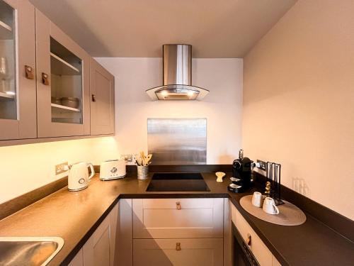 a kitchen with a sink and a counter at Appartement de Standing - Ski au pied in Val Thorens