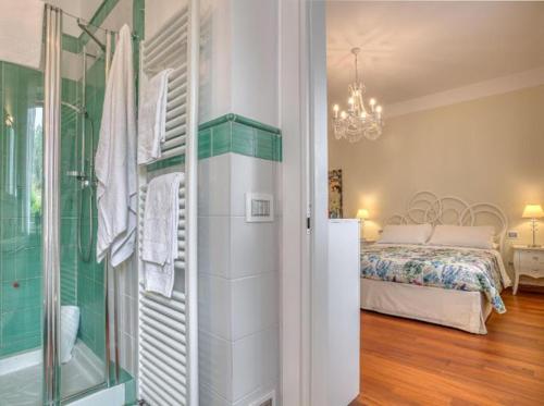 Una cama o camas en una habitación de Hotel Villa De Santis