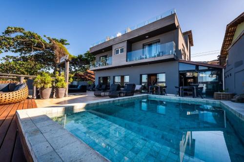 A piscina localizada em Casatua Pousada ou nos arredores