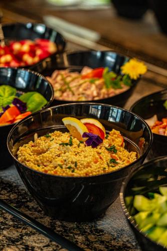 a buffet of different types of food on a table at Logis Hôtel - Le Relais du Parisis in Villeparisis