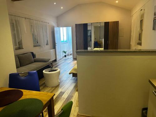 a kitchen and living room with a couch and a table at Deluxe apartment Playa in Valbandon