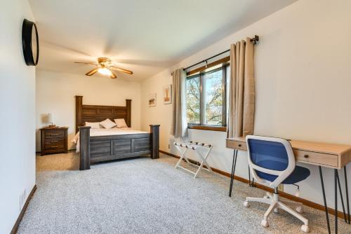 a bedroom with a bed and a desk and chairs at Cozy Lewiston Home Less Than 10 Mi to Niagara Falls! in Lewiston