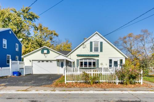 a white house with a white fence at Cozy Lewiston Home Less Than 10 Mi to Niagara Falls! in Lewiston