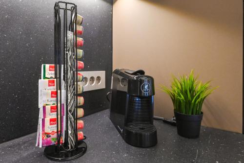 a hair dryer on a counter in a room at Aparthotel OLIVE with jacuzzi and breakfast in Novalja