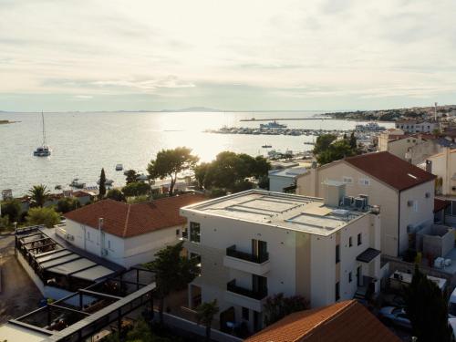 an aerial view of a city and the water at Aparthotel OLIVE with jacuzzi and breakfast in Novalja