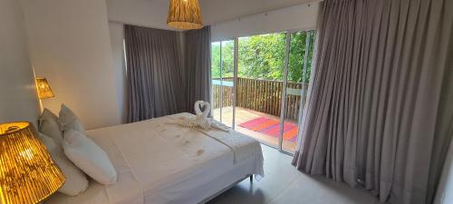 Een bed of bedden in een kamer bij Casa Duna - Family Friendly