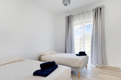 Ένα ή περισσότερα κρεβάτια σε δωμάτιο στο 14 Esteva Resorts 2E Aljezur 5 min to the Beach