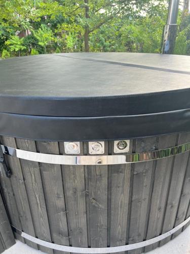 a wooden fence with a table on top of it at Vila Phoenix in Călimăneşti