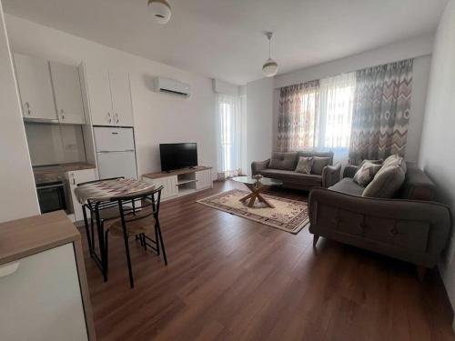 a living room with a couch and a table at Pegasus luxury 1 in Tirana