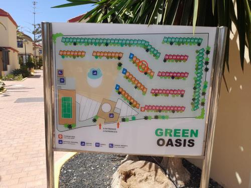 a sign for a green oasis at Casa Christian Costa Calma beach in Costa Calma