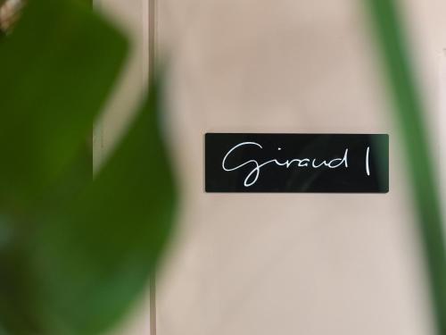 a sign on a door with the word grward at Giraud I - Luxurious secluded villa next to the sea in Lajares