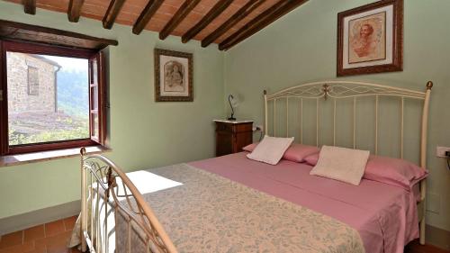 Ένα ή περισσότερα κρεβάτια σε δωμάτιο στο La Chiocciola