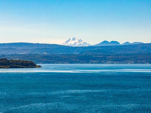 a view of the water with a mountain in the background at Park Lake Luxury Hotel in Pucón